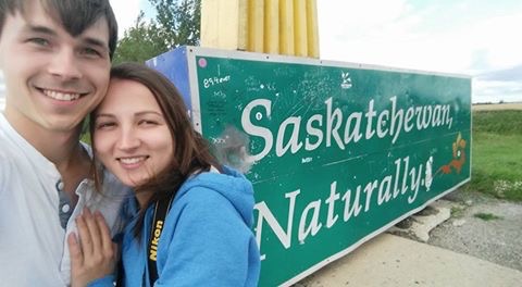 Vee and me in front of the Saskatchewan welcome sign